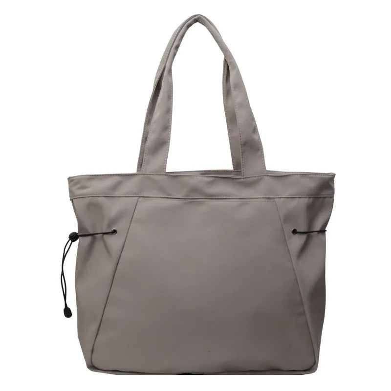 Foldable Oxford cloth commuter tote bag in street trend style, shown in multiple colour options.