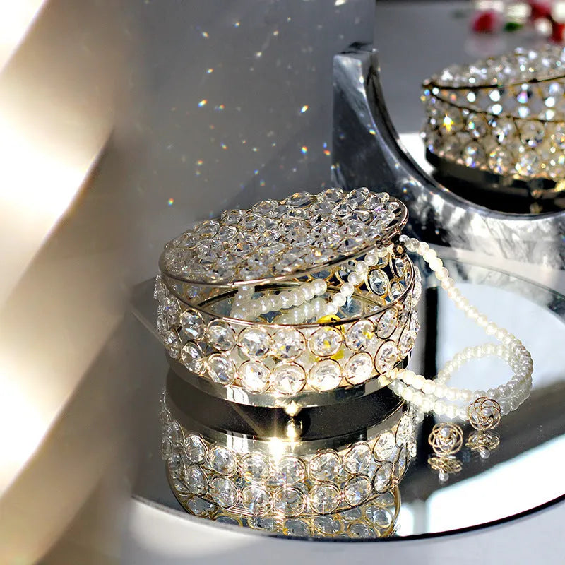 Clear crystal glass jewellery storage box with a French gold-coloured metal frame.