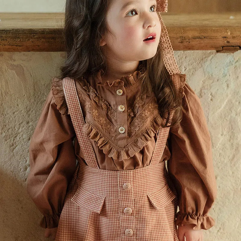 Cotton girls princess shirt with lace collar and long puff sleeves in beige on white background