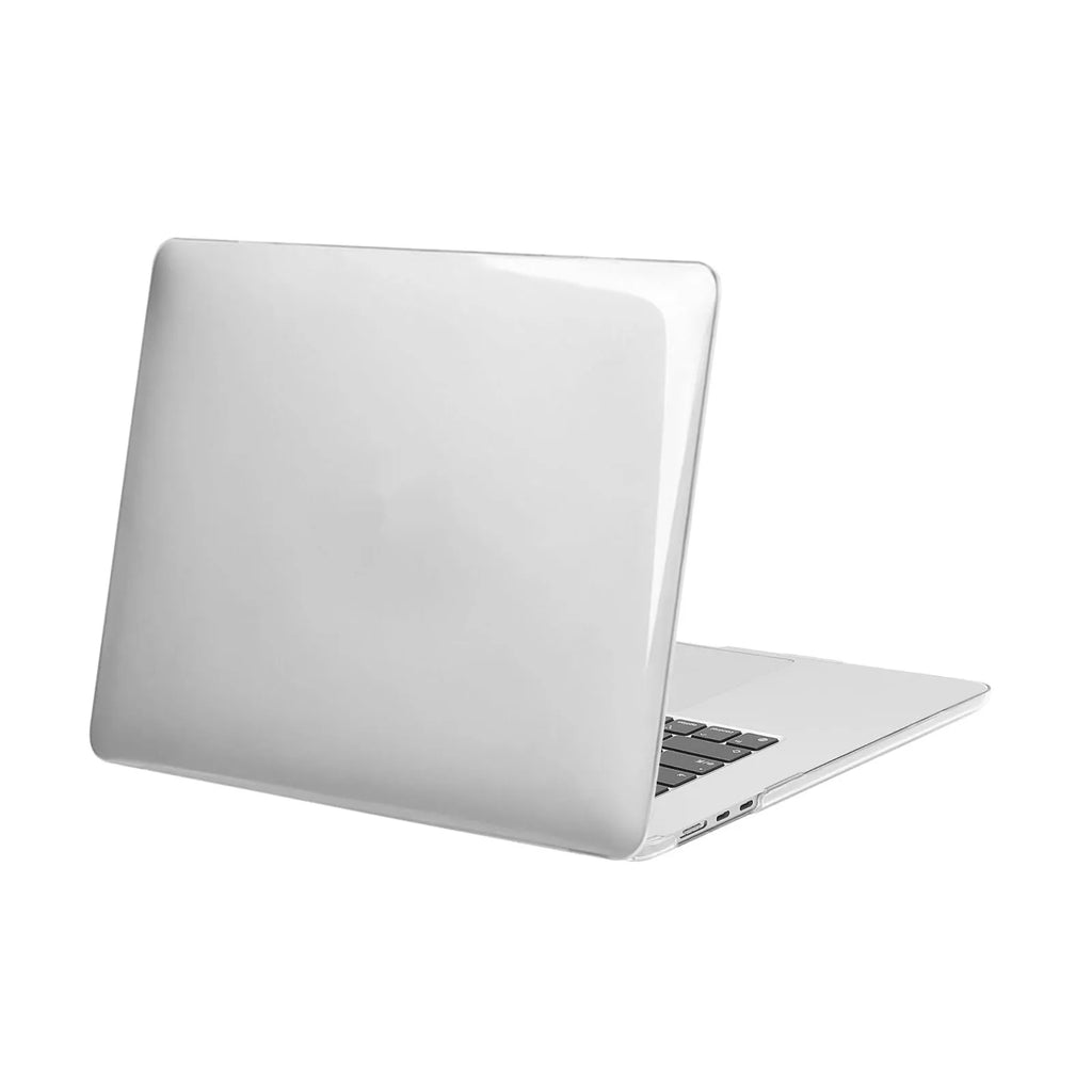 Transparent plastic protective shell for a MacBook laptop on a table.