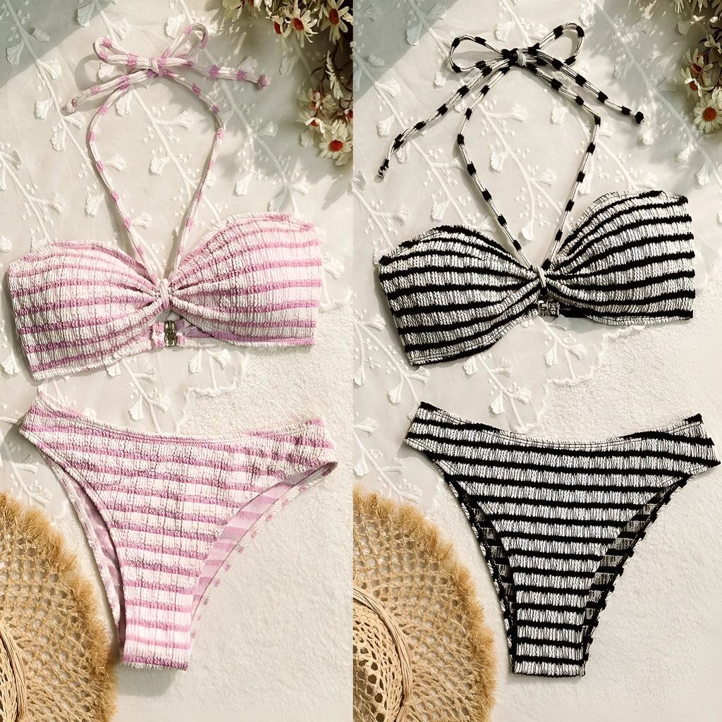 Women's pink and black striped bikini swimsuit top and briefs on a mannequin