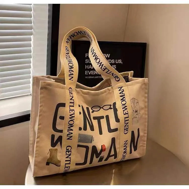 Large canvas women's tote bag with printed design options including letters and patterns
