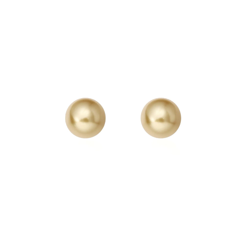 Close-up of a women's large pearl stud earring with an eight-point geometric silver star setting.