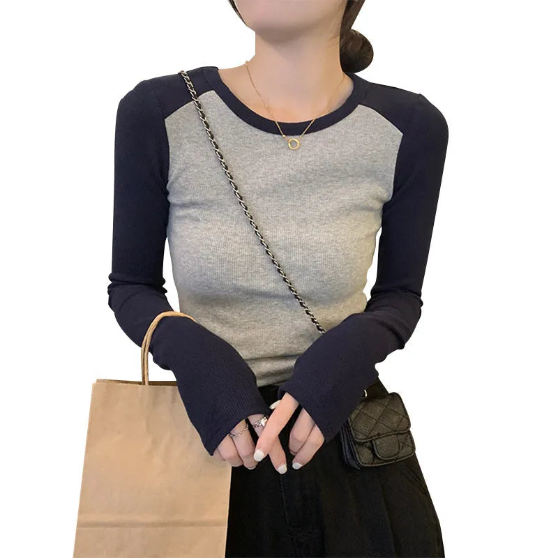 Women's slim fit viscose top with long princess sleeves and embroidery detail in dark blue.