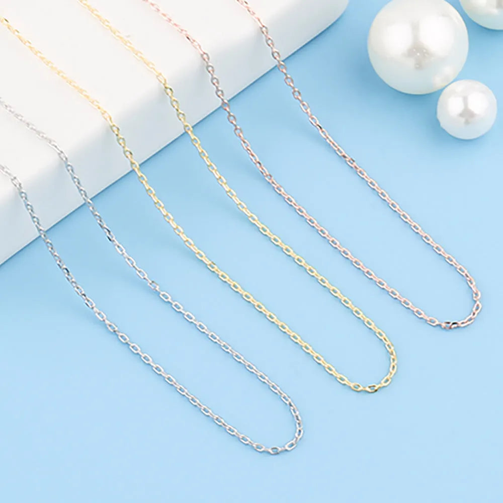Stainless steel necklace with a U-shaped pendant on a chain, shown in steel, gold, and rose gold colour options.