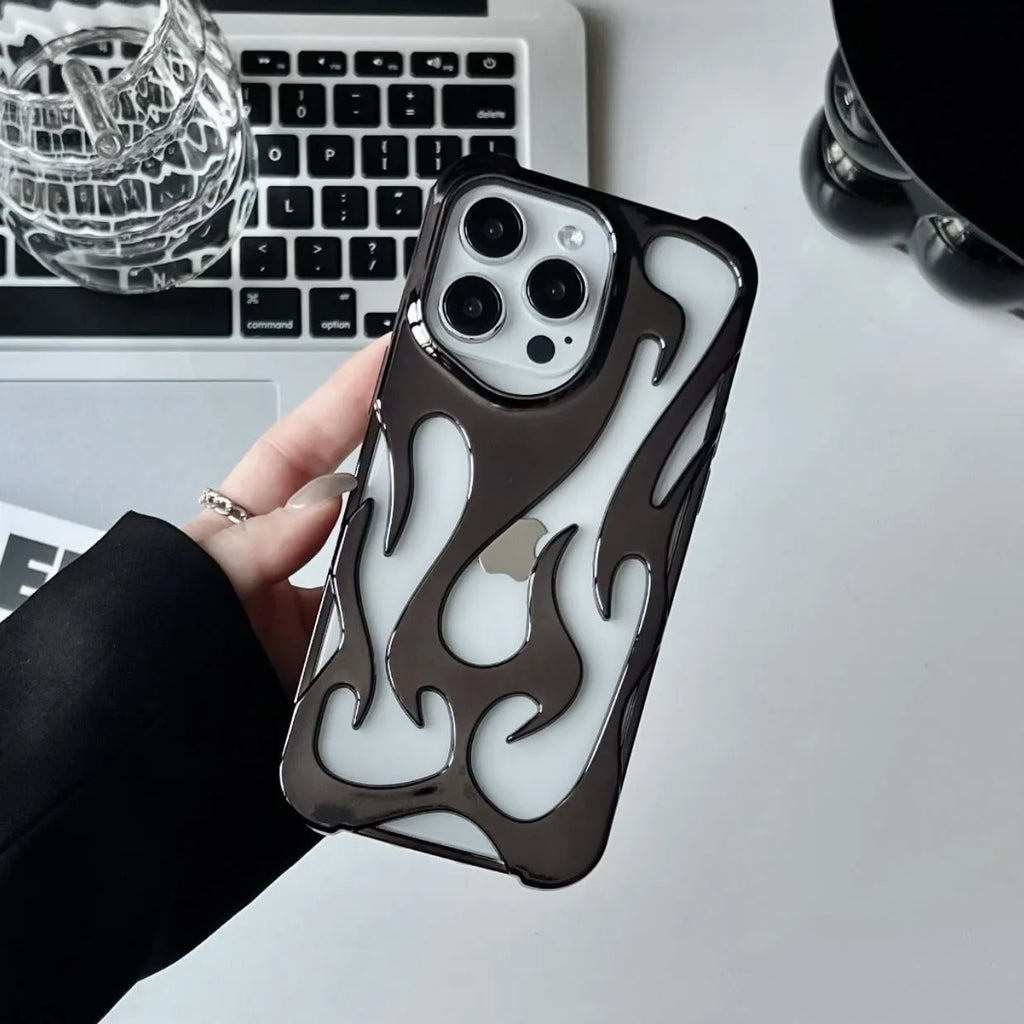 Electroplated hollow flame pattern iPhone case in silver, showing detailed cut-outs and metallic finish on a phone.