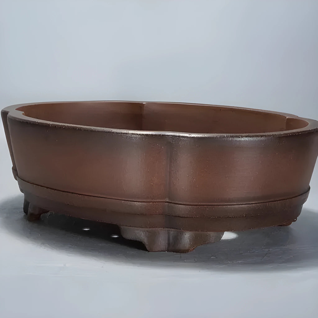 Classical green plant design purple clay bonsai pot for indoor use.