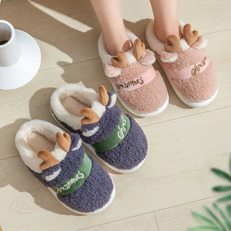 Christmas elk winter home slippers in pink with suede upper and thickened EVA sole on a cream background