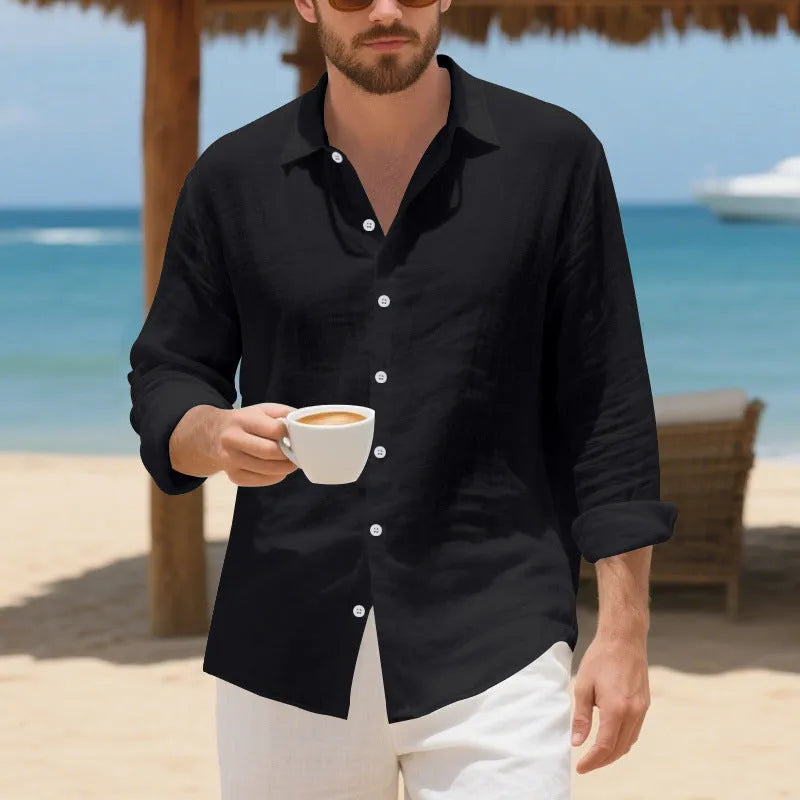 Man wearing a light blue loose-fit linen casual shirt with a button front and classic collar.