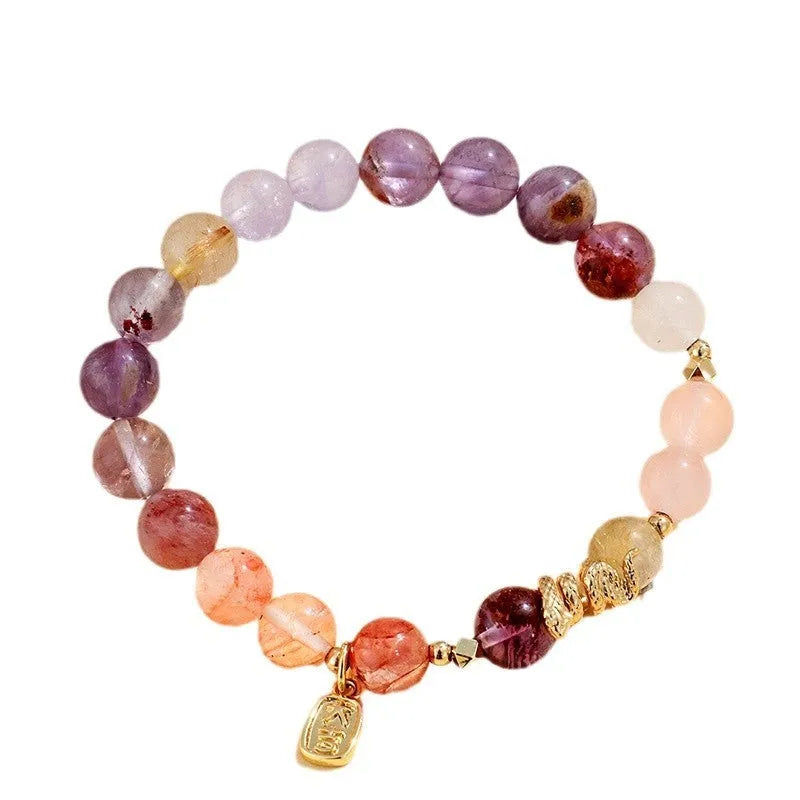 Women's crystal bracelet with Fu snake charm and plastic flower beads on wrist