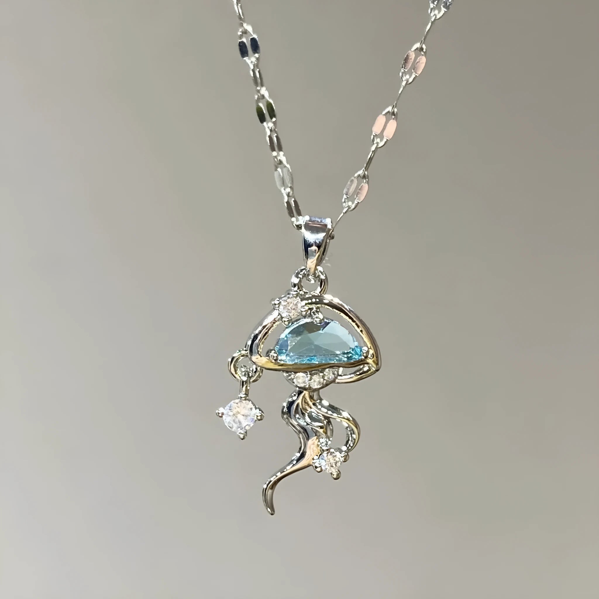 Sterling silver blue jellyfish necklace with white gold finish on adjustable chain