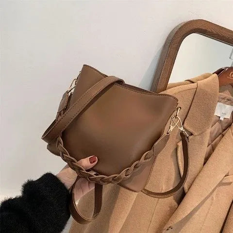 Retro one-shoulder crossbody bucket bag in woven PU material, shown in khaki colour.