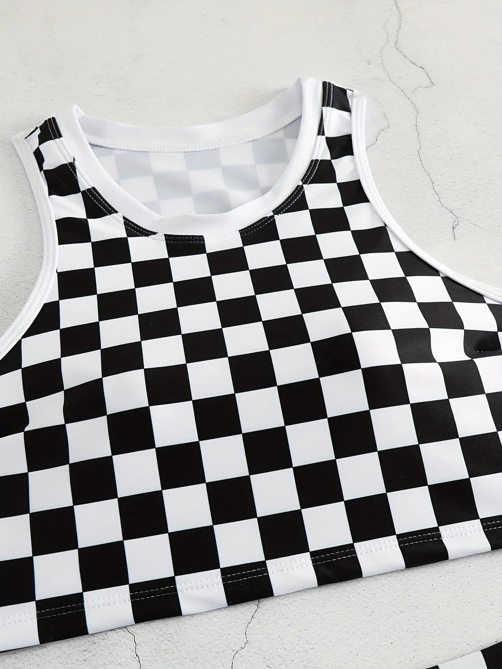 Women's racing one-piece swimsuit with suspender straps and chessboard pattern