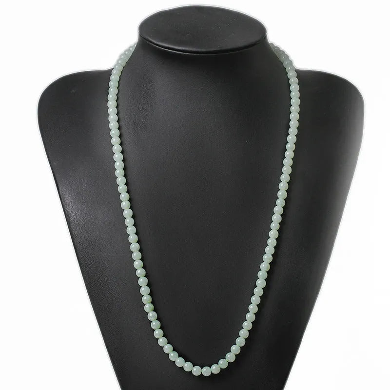 Natural A-level jade bead necklace with white and green round beads on an adjustable chain.