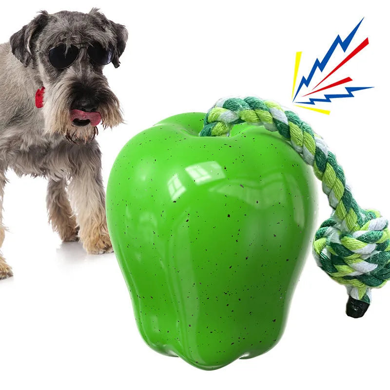 Green and red plastic dog dental ball toys with textured surfaces and hollow interactive feeder design