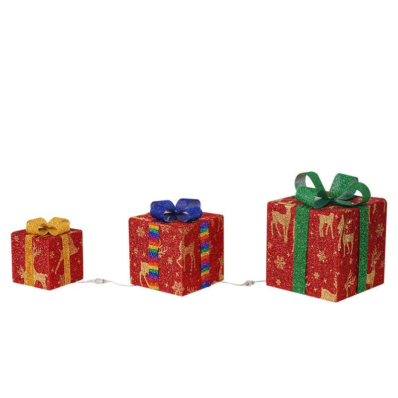 Set of three pre-lit Christmas gift box decorations with bows and LED lights for outdoor use