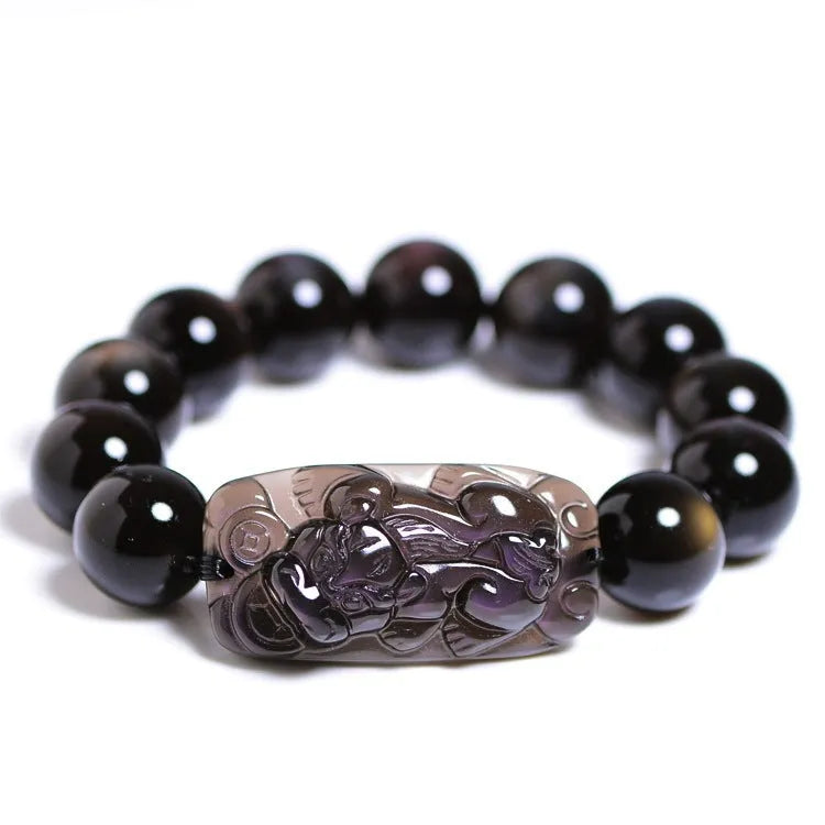Polished crystal Pi Xiu bracelet with geometric beads on wrist, showing ice stone colour.
