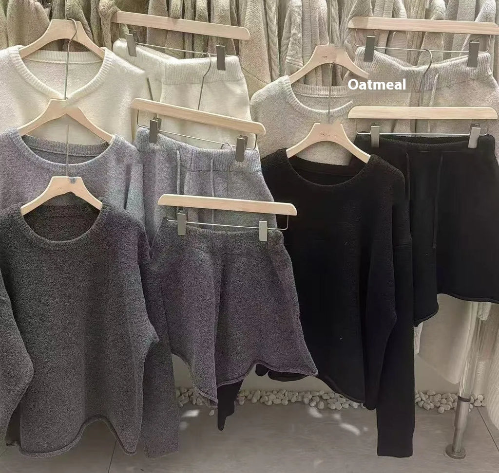 Women's loose-fit long sleeve acrylic knit sweater and matching wide-leg shorts set shown in oatmeal colour.