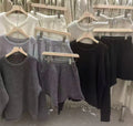 Women's loose-fit long sleeve acrylic knit sweater and matching wide-leg shorts set shown in oatmeal colour.