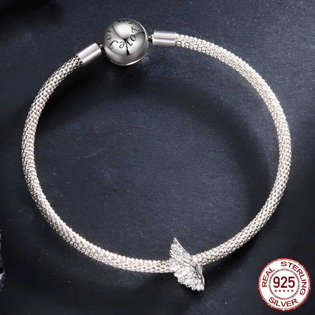 S925 sterling silver wing bead inlaid with zircon on a white background showing 1.4cm size
