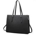 Large black business laptop bag showing multiple internal organisers and three shoulder strap options for women's daily commuting