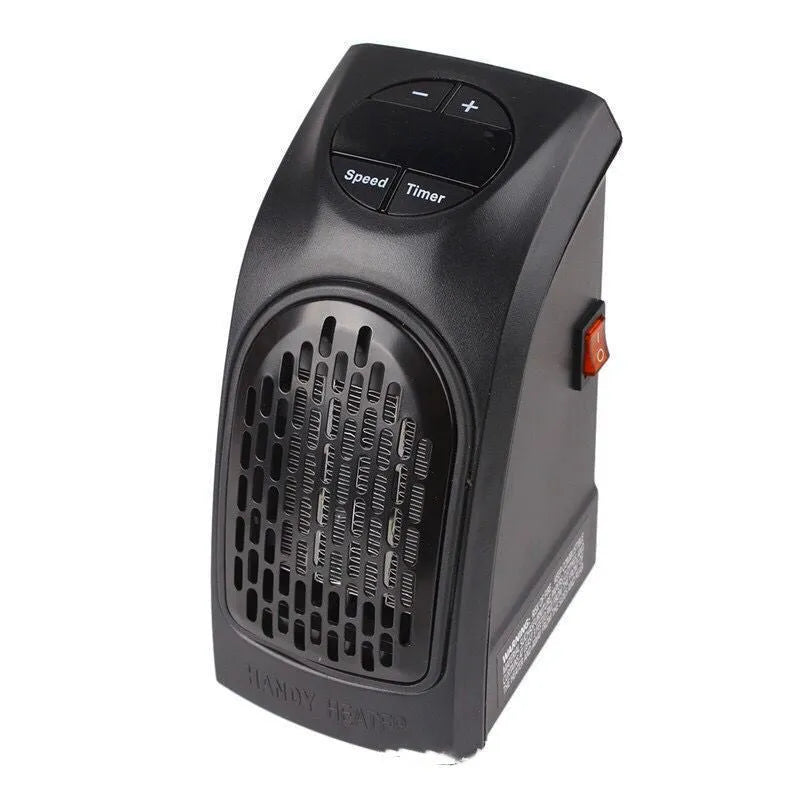 Small black ceramic fan heater on a table showing control buttons and compact size.