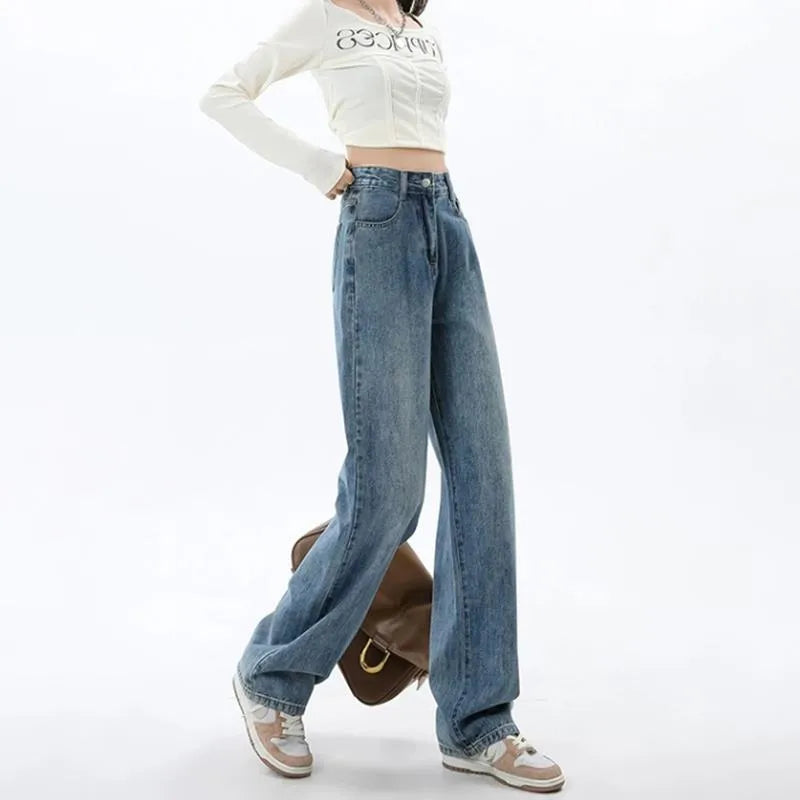 Woman wearing retro blue high-waist wide leg denim jeans with a relaxed fit.