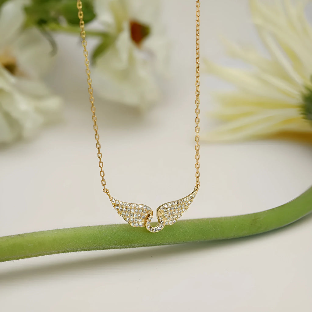 925 sterling silver wings fashion necklace on display with electroplated finish in white or yellow gold tone