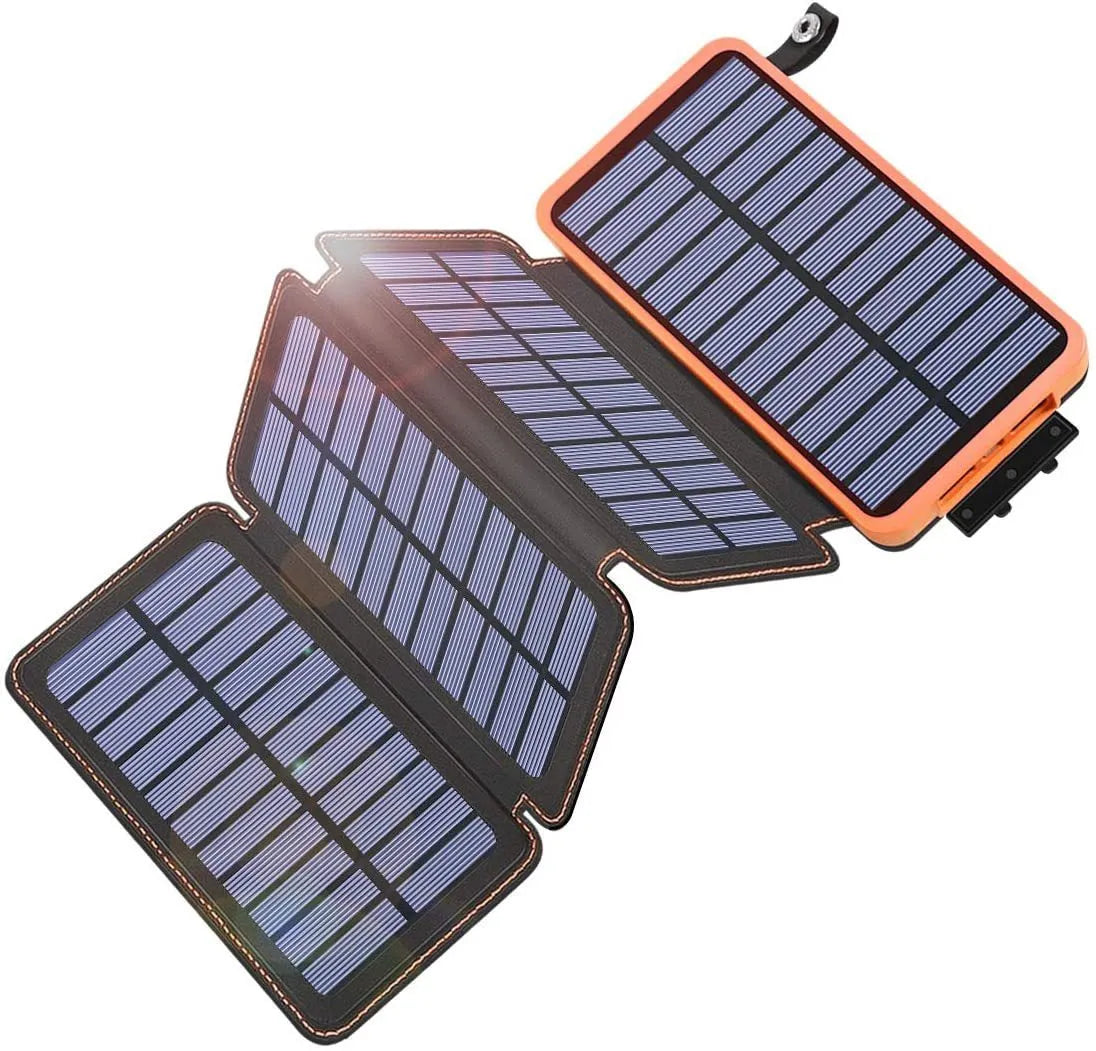 Black outdoor solar power bank with leather finish, showing solar panel and USB ports, next to a charging cable.