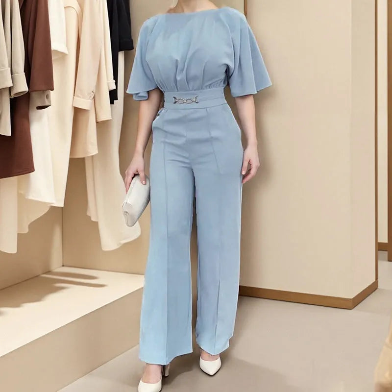 Blue polyester men's suit set with long sleeve jacket and trousers on a hanger.