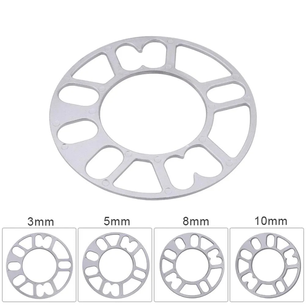 Set of four metal wheel hub widening gaskets in 3mm, 5mm, 8mm, and 10mm thicknesses for automotive modification.
