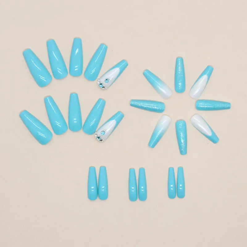 Long ballet shaped press-on nails with solid blue diamond glitter colour.