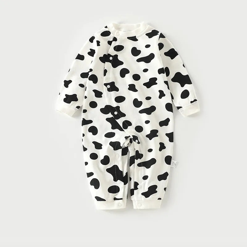 Cotton baby long climb pajamas in a colourful print, shown laid flat, suitable for spring and autumn.