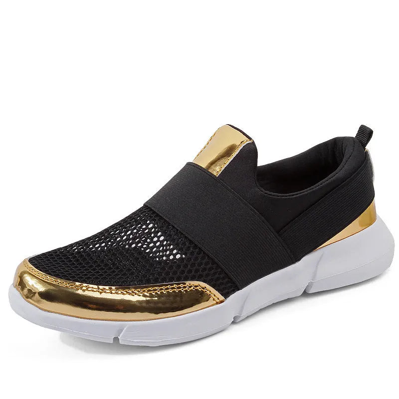 Women's low-top blue casual sneakers with mesh material and a PU midsole on a hard floor.