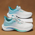 Men's white and orange mesh low-top sneaker with a rotating buckle closure and rubber sole.