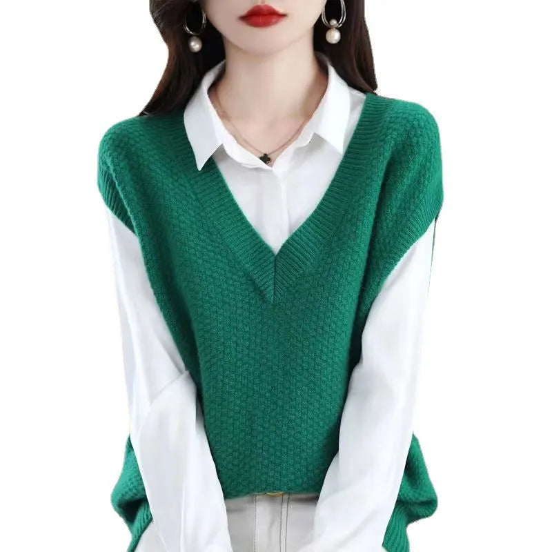 V-neck sleeveless knitted vest with a raised 3D pattern in a camel colour.