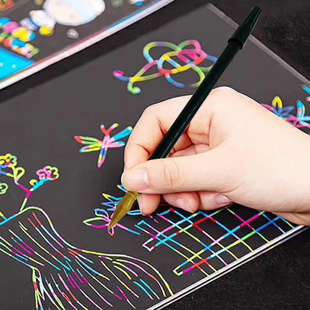 A white PS plastic scratch art pen for children's drawing and colouring on scratch paper.