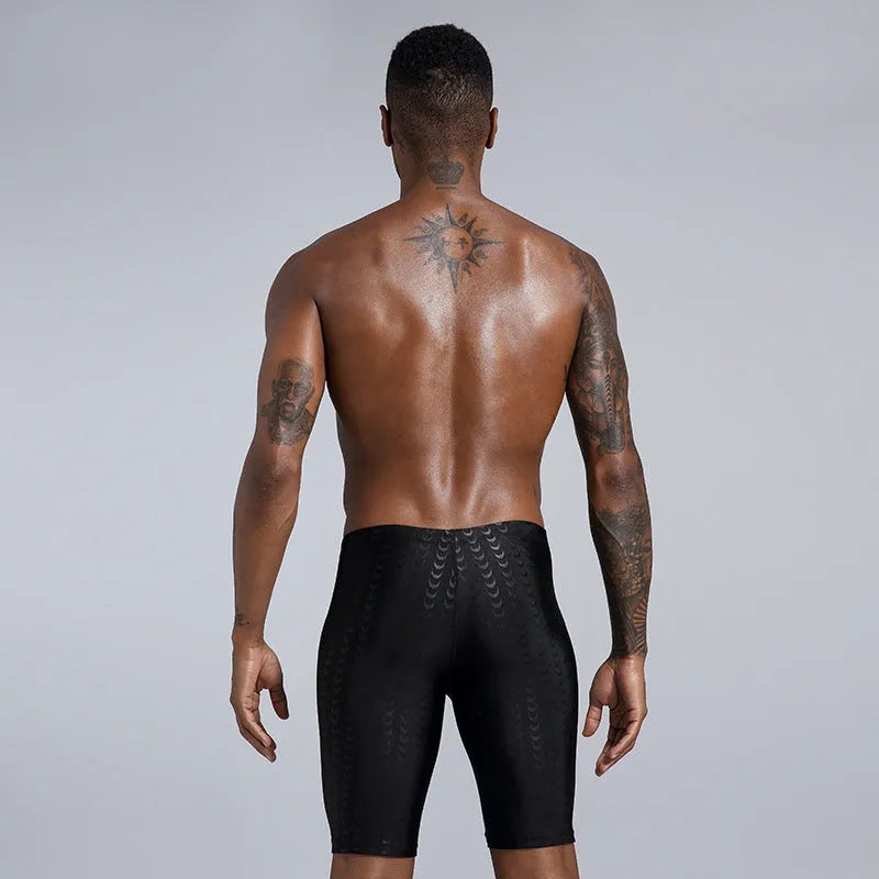 Men's solid colour swimming trunks in waterproof shark skin polyester fabric