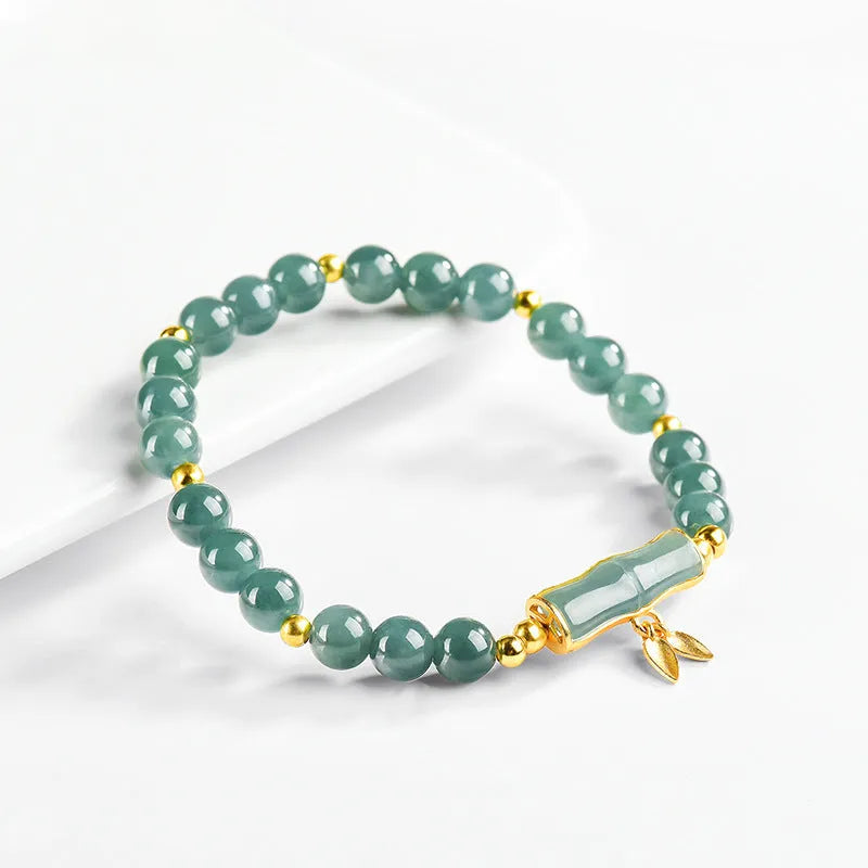 Cargo jade bracelet with blue water round beads on a S925 sterling silver chain.