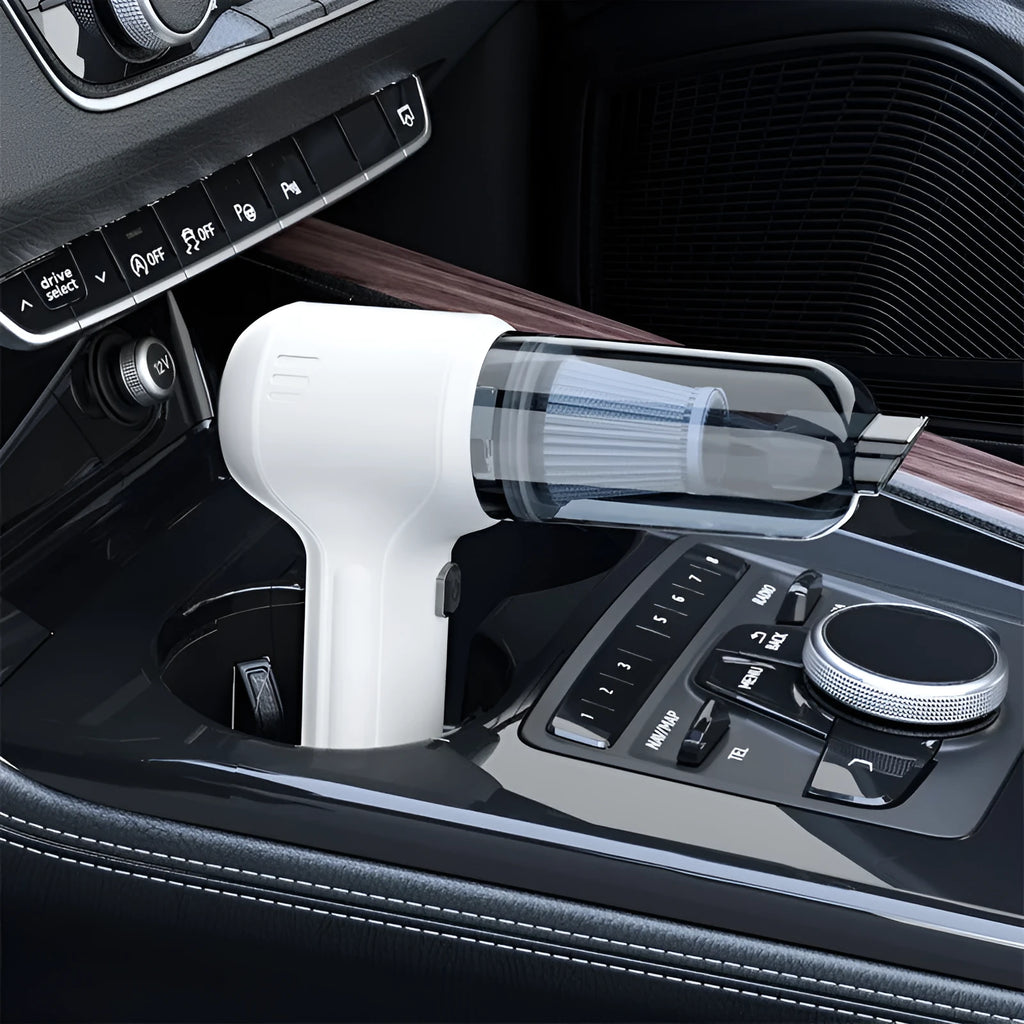 Black wireless wet and dry car vacuum cleaner with multiple nozzle attachments on a white background.