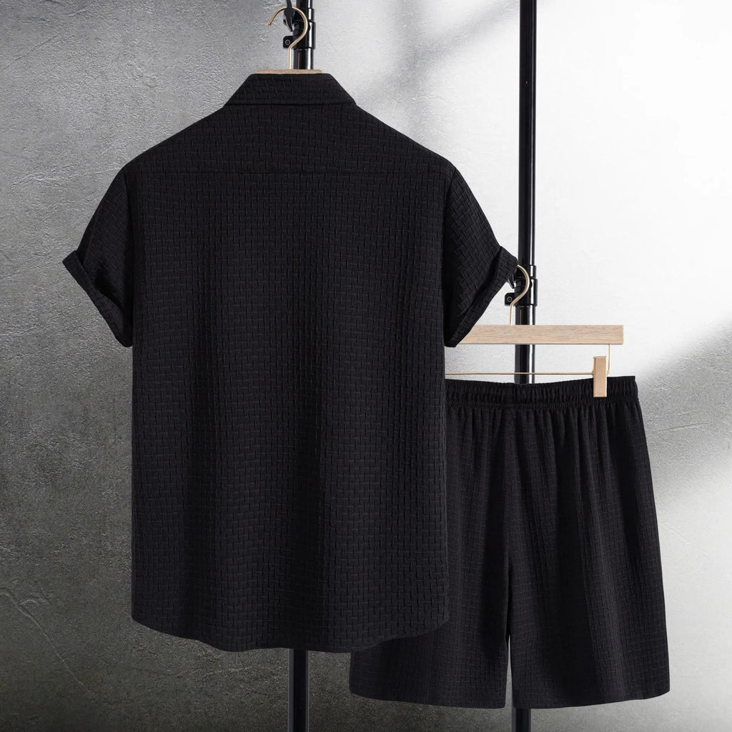 Men's white cotton blend beach shorts suit with short sleeve shirt on a hanger.