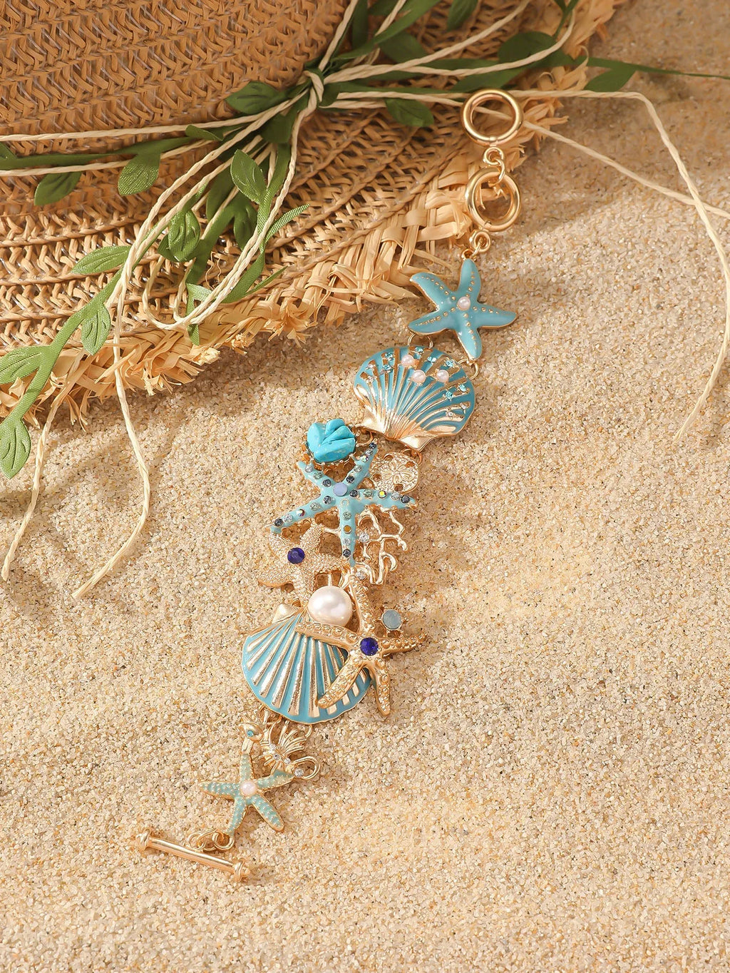 Women's alloy rhinestone nautical bracelet with starfish and anchor charms in turquoise, red, or blue.