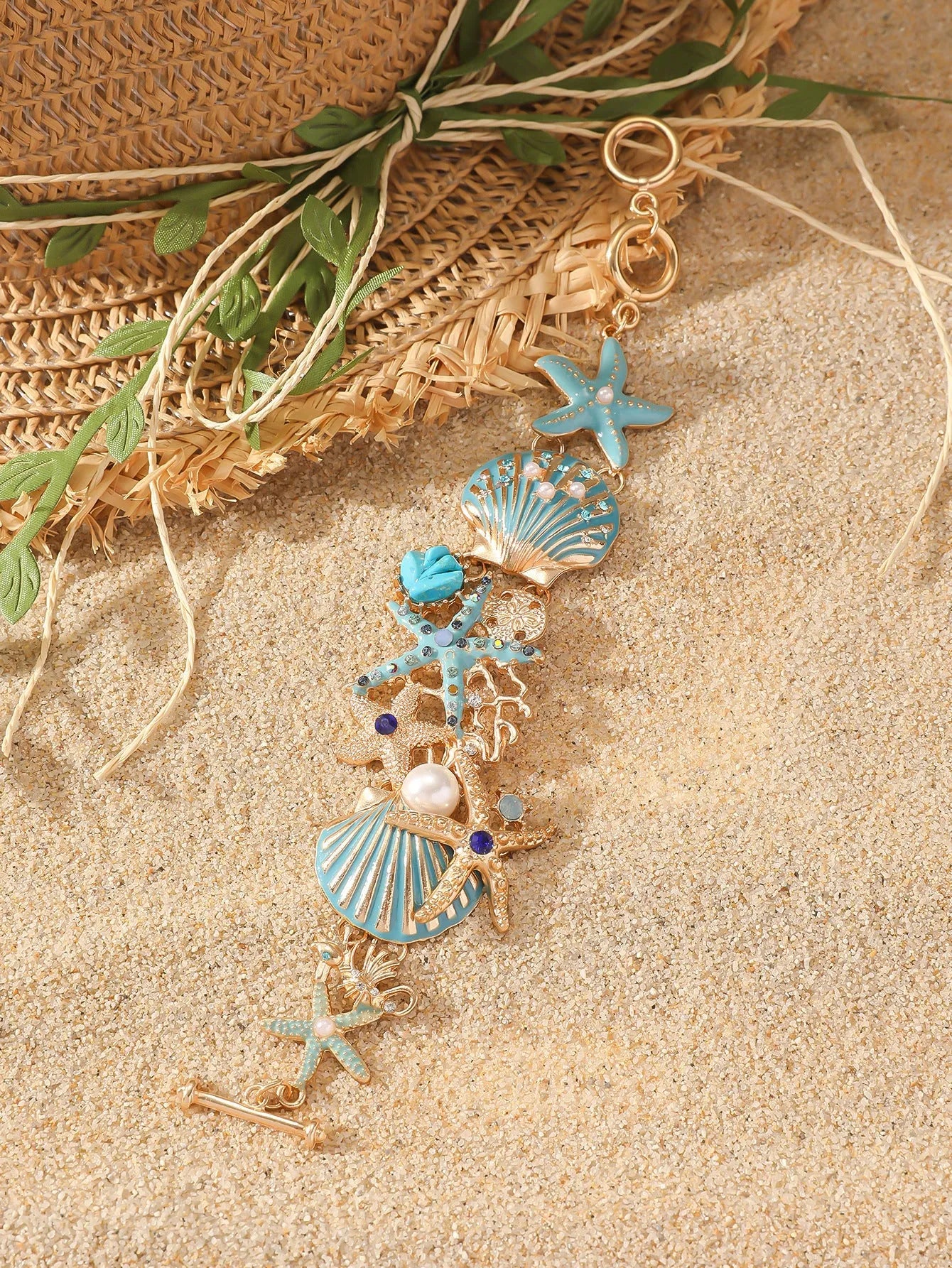 Women's alloy rhinestone nautical bracelet with starfish and anchor charms in turquoise, red, or blue.