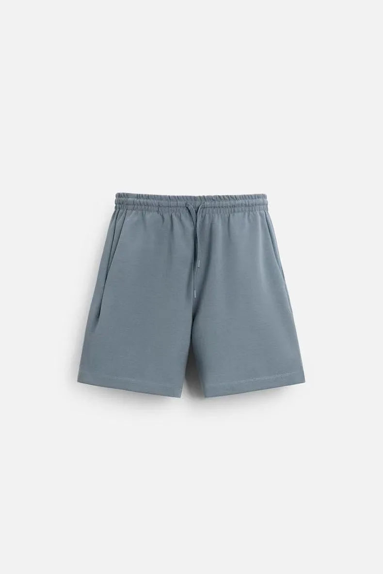 Loose double-sided cloth texture short sleeve shirt and matching shorts casual set on a hanger.