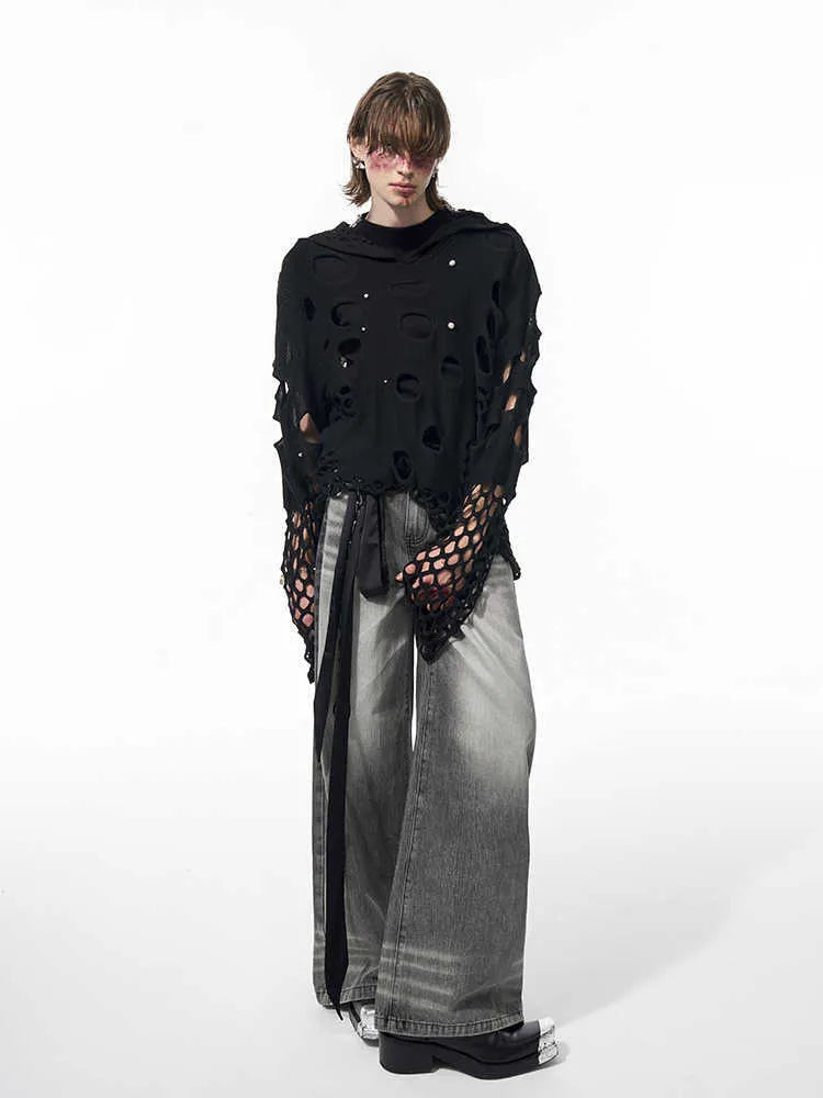 Black men's loose hoodie with a pearl decoration on the hood, shown on a model.