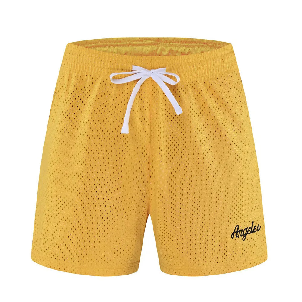 Men's double-layer mesh shorts in sports purple, showing the breathable fabric and casual fit.