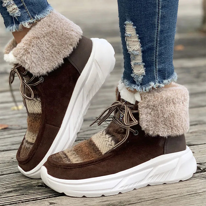 Women's beige lace-up suede snow boots with a thick rubber sole and plush lining, shown from the side.