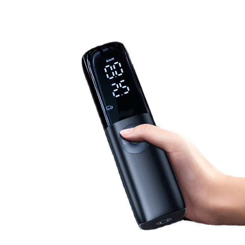 Black portable car tyre inflator with pressure gauge and plug connection