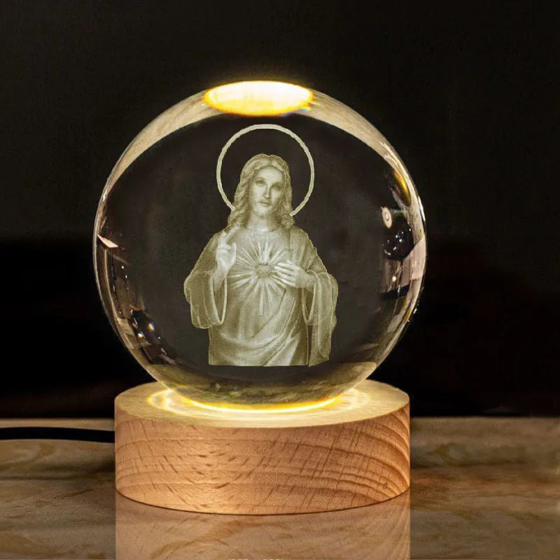 White crystal ball desk ornament on a wooden warm light base, showing purity-themed designs.