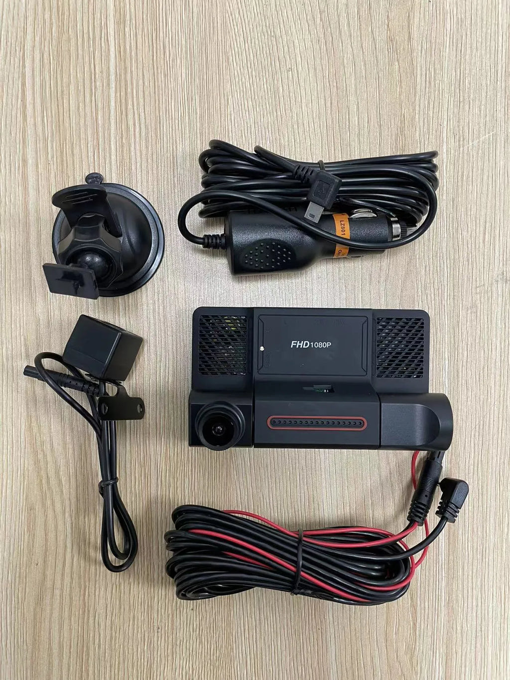 Black three lens dashboard camera with 4 inch touch screen for front and rear vehicle recording